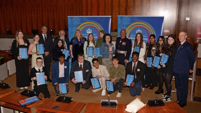 A group of teenagers with their Lord-Lieutenant Young Person of the year certificates 