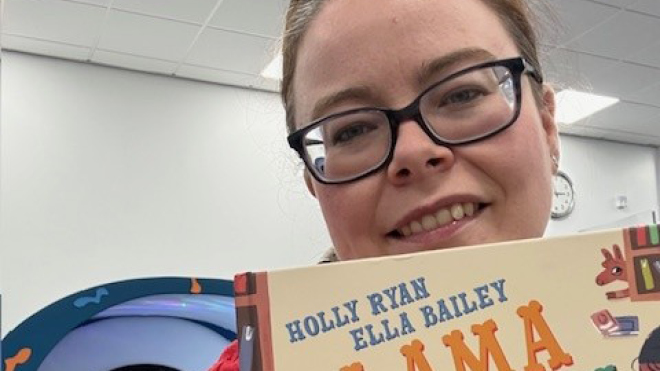 Librarian holding a book