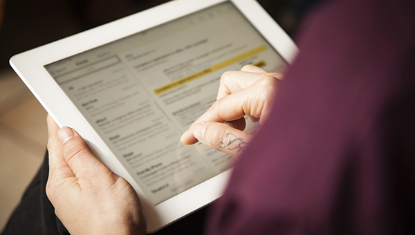 someone using a tablet device someone using a tablet device