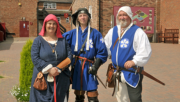 people dressed up in period costume