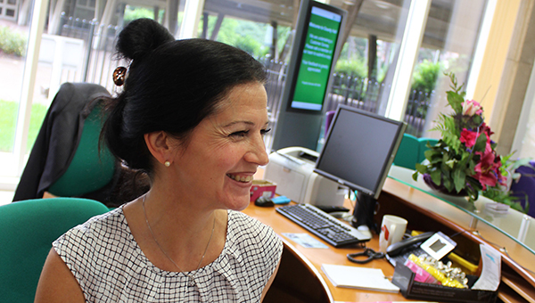 Working for the council A member of staff sitting at her desk