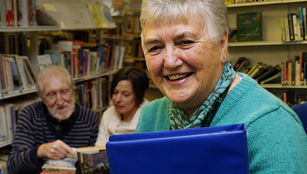 Volunteering A volunteer helping at her library
