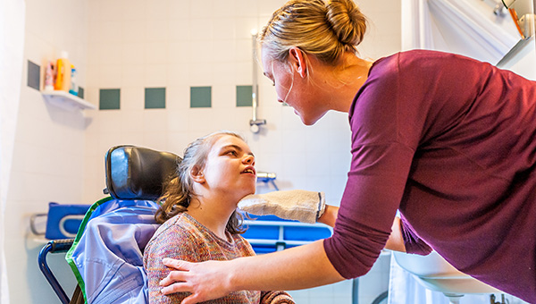 A disabled child with a carer A disabled child and a carer
