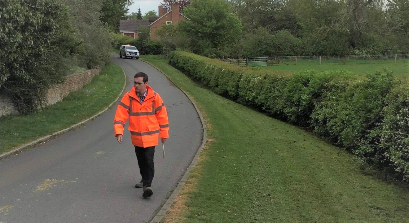 Man carrying out flood risk management assessment