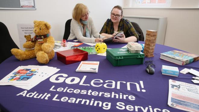 People have a chance to improve their skills and further their careers Two people going discussing the GoLearn courses on offer
