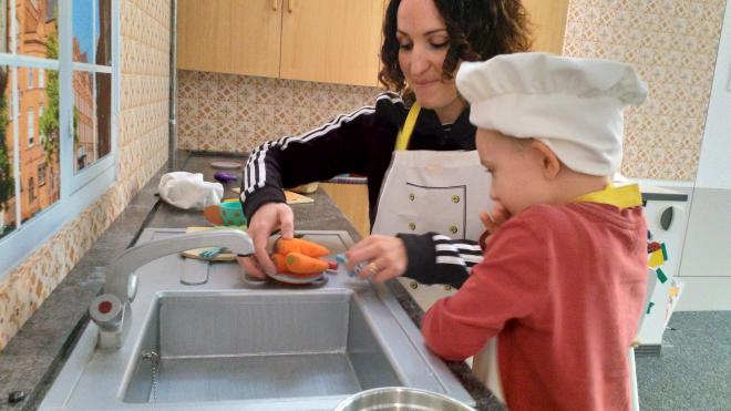 A schoolboy in the kitchen at a Harborough Museum exhibition