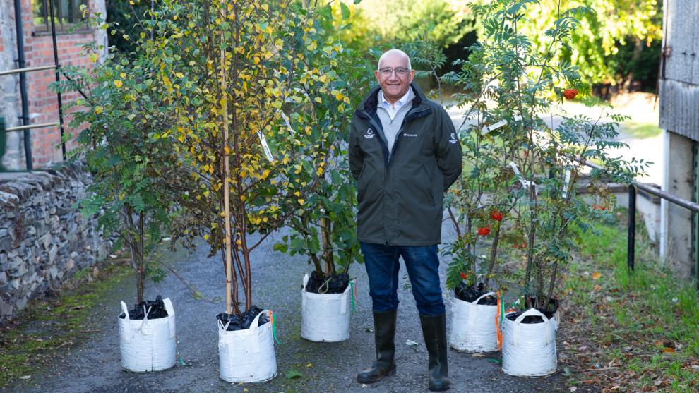 Mike Kapur OBE with the five trees Mike Kapur OBE with the five trees