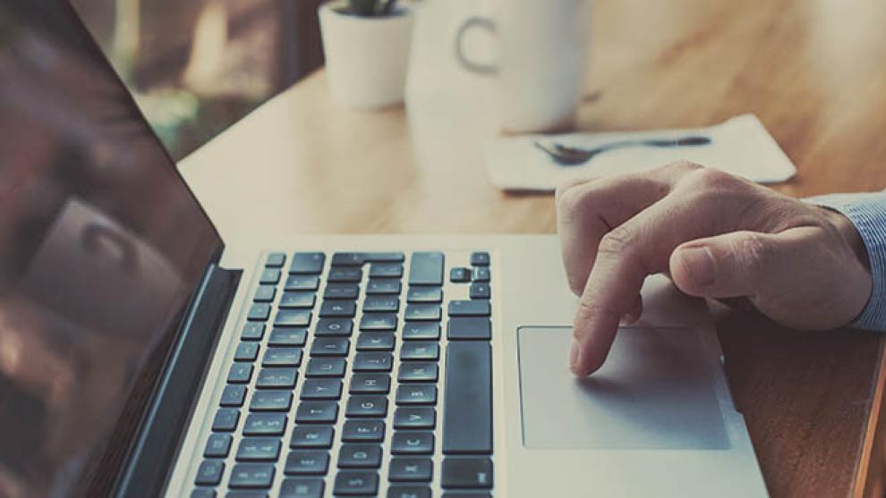 Kickstart is aimed at getting young people into permanent employment. A person using laptop