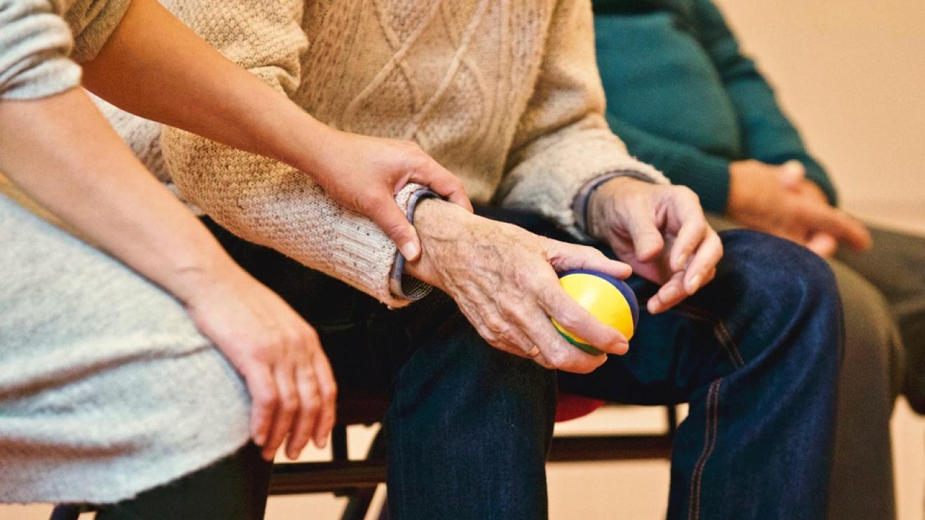 Woman caring for older man