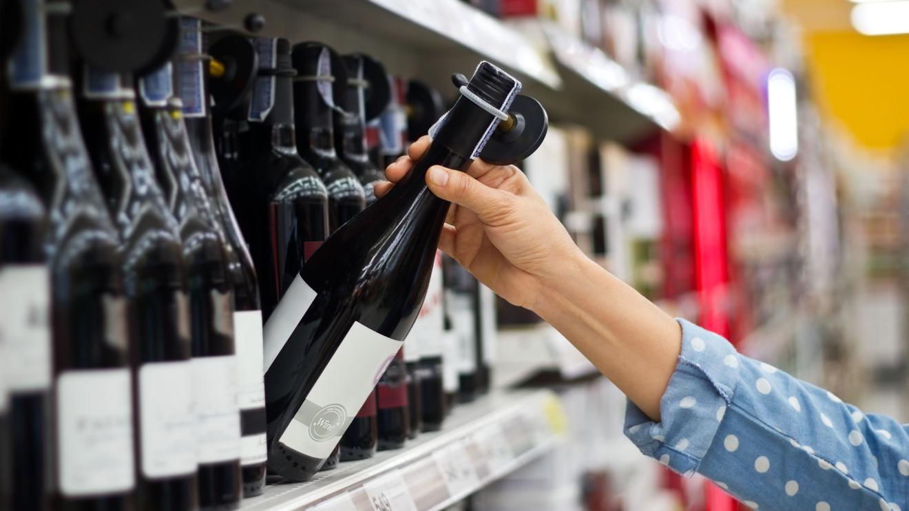 Bottles of wine on shelves in shop