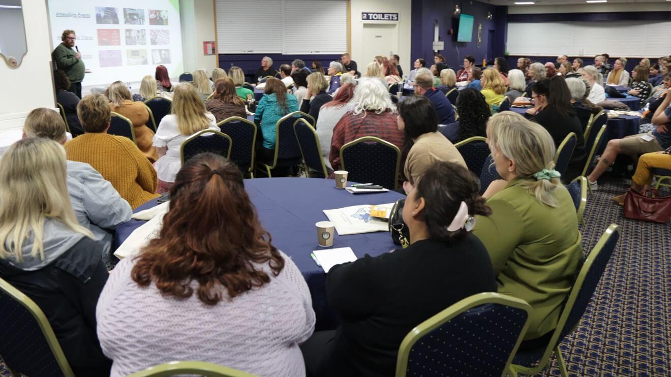 Group of people attending a learning disabilities partnership board conference