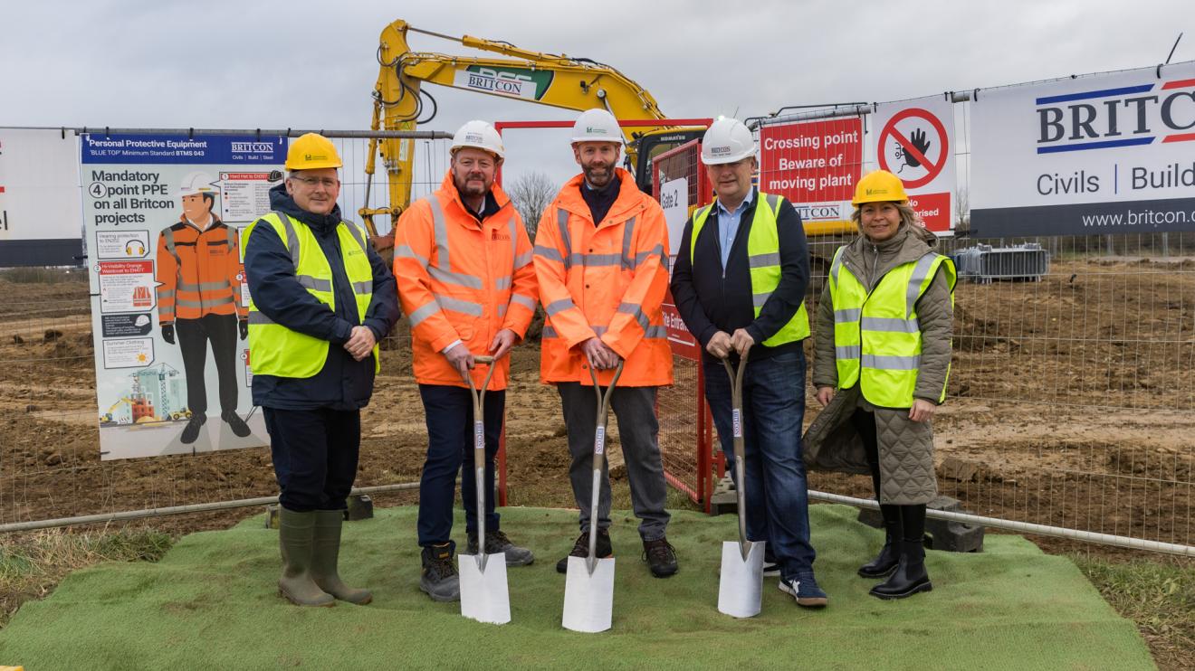 Airfield business park Representatives from Bramble Foods, Leicestershire County Council and Britcon standing in front of the site where Airfield Business Park will be built