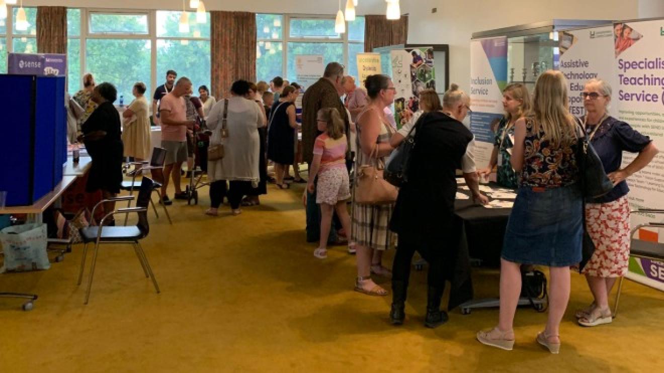Visitors and stall holders during a Local Offer roadshow event
