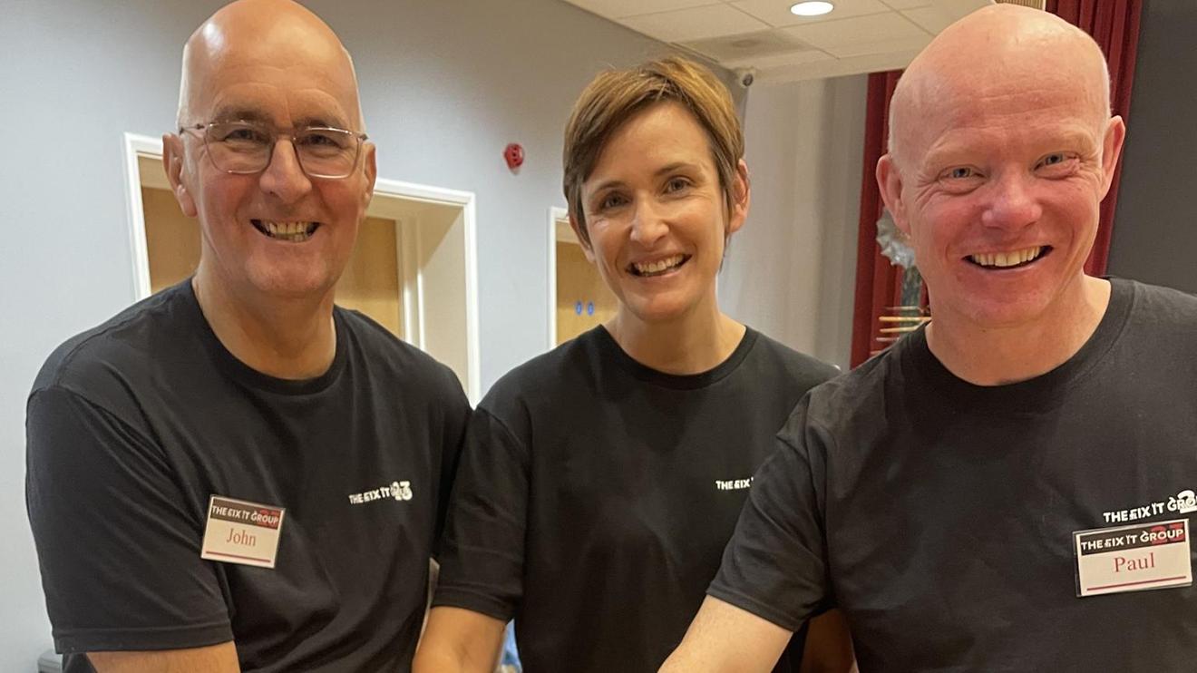 John Fitzgerald, Paul Worth and Joanne Liversidge celebrating Fix It Group 23’s first anniversary.