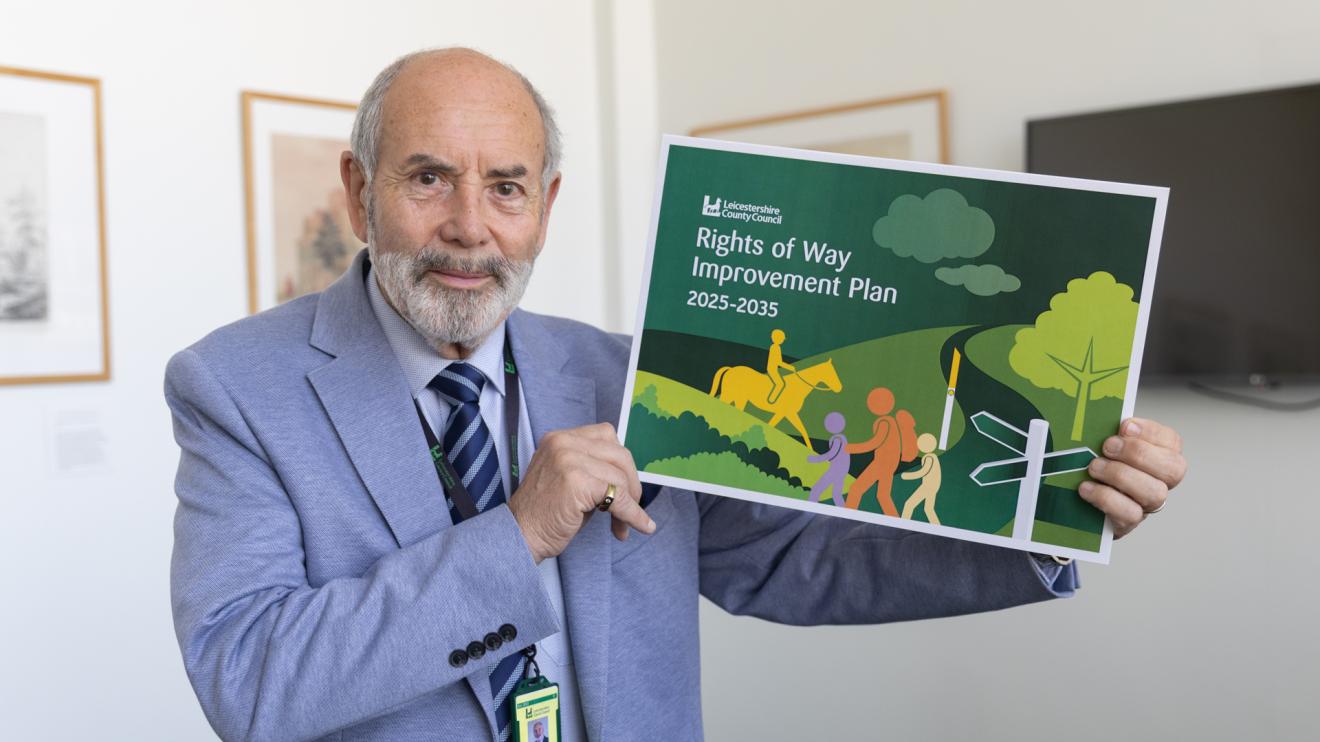 Council Leader Dan Harrison holds the draft rights of way improvement plan