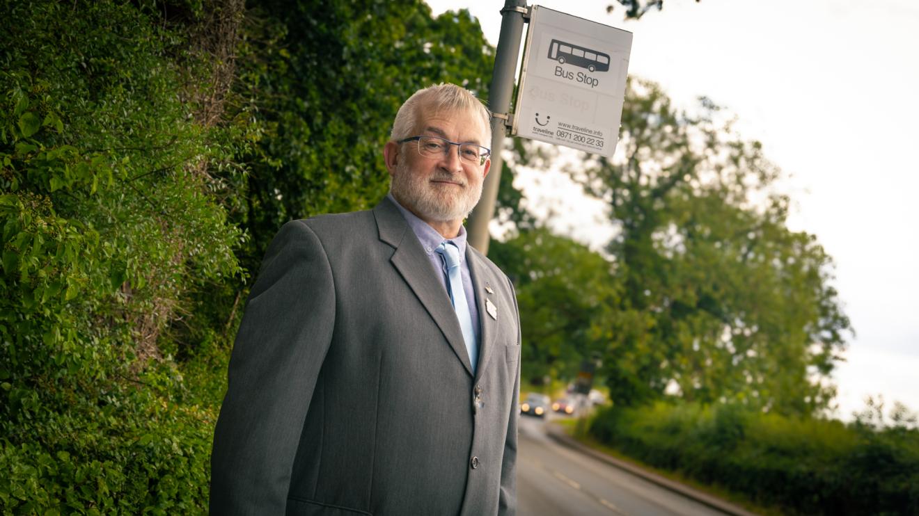 Councillor Charles Whitford at a bus stop