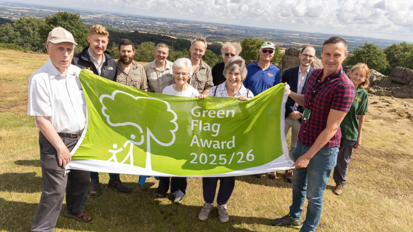 Rangers, volunteers and Cllr Adam Tilbury with Green Flag award at Beacon Hill Country Park