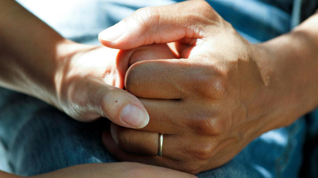 Two hands clasping