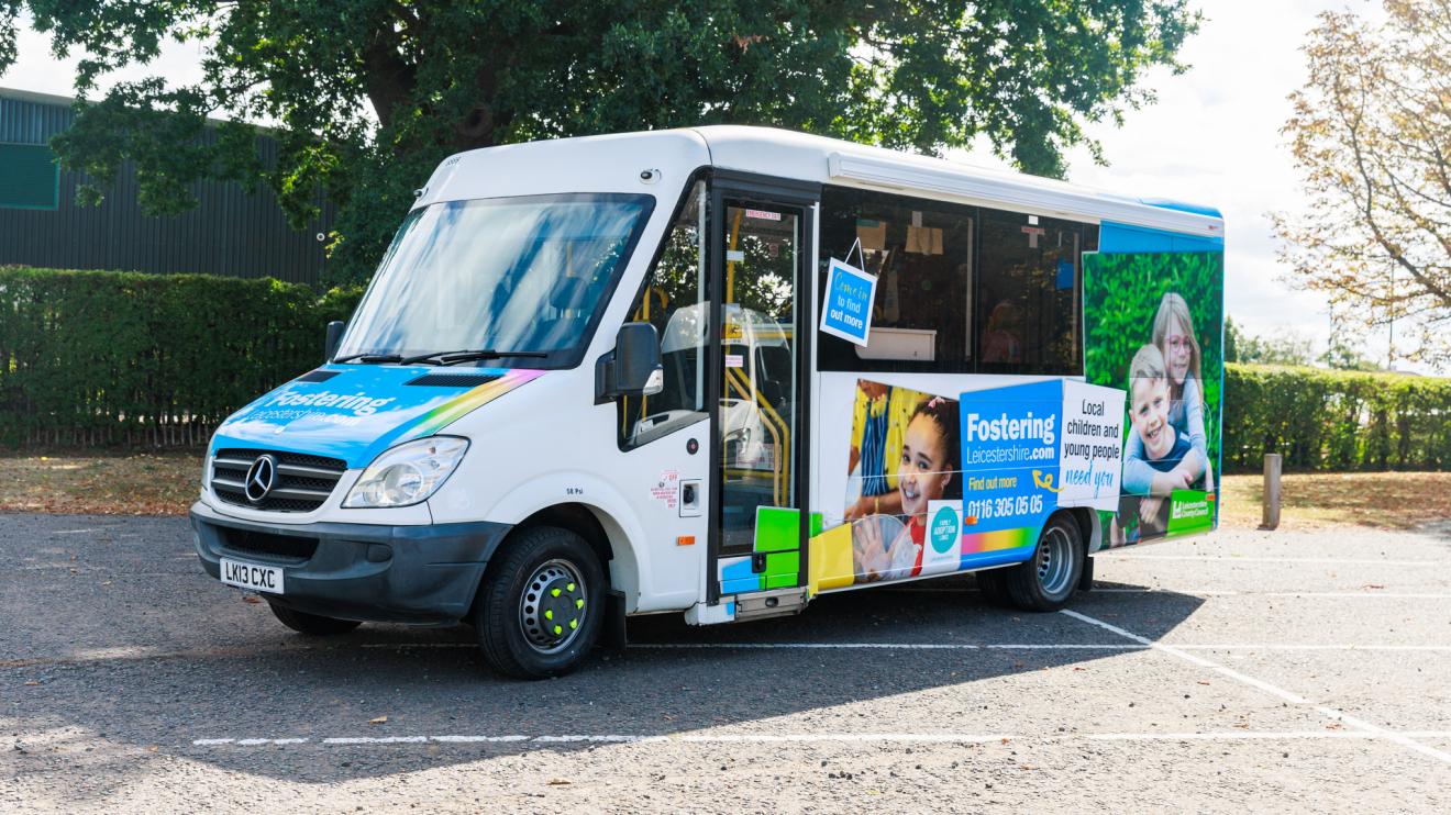 fostering minibus A white minibus with colourful livery promoting fostering