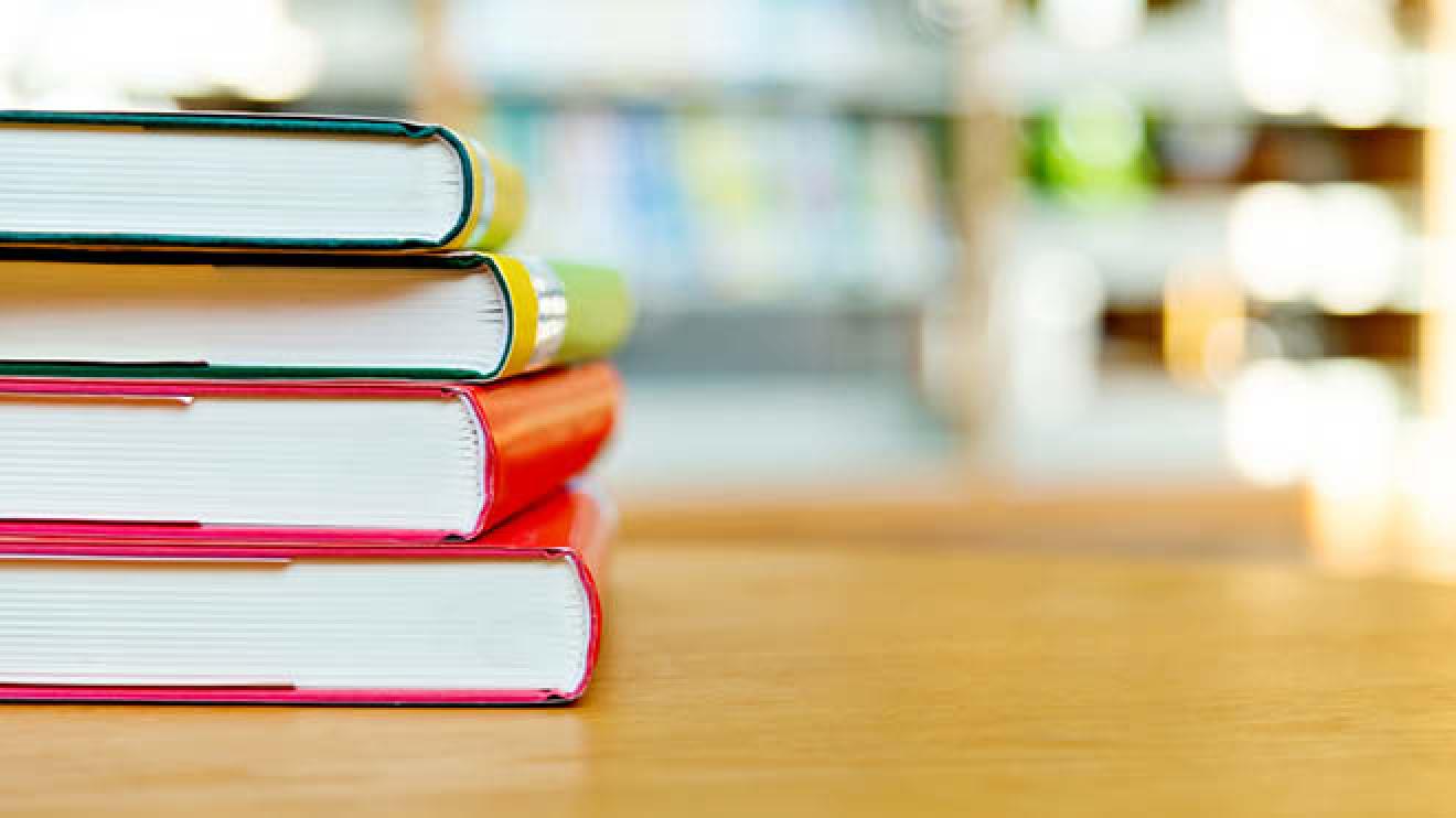 Books stacked up on a table