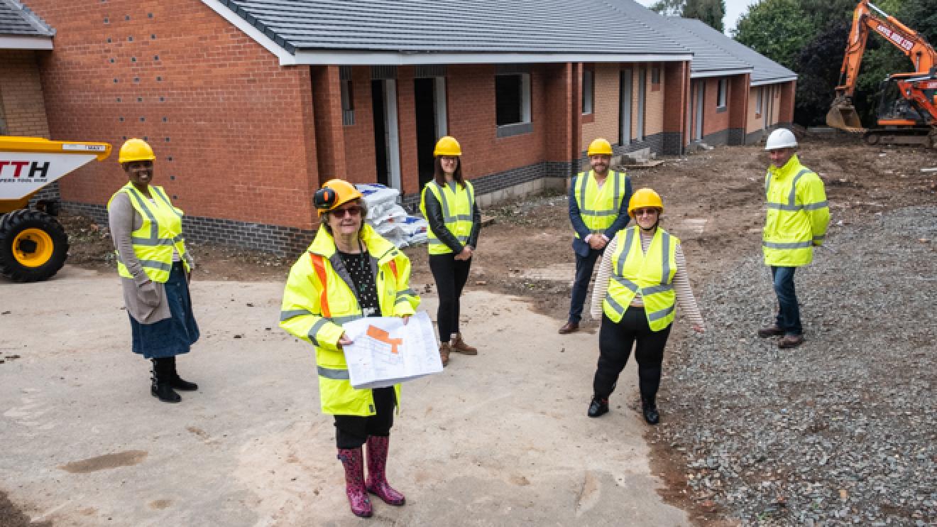 Affinity Trust, Leicestershire County Council, and JWF Group Midlands visiting Billa Barra with Ruth (L-R Simo Dube, Christine Radford, Natalie Leader, Richard Tellam-Clark, Ruth Neal, and Neil French) group of people social distanced on a building site