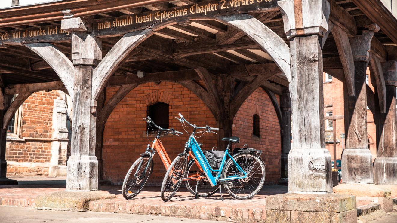 Electric bikes in Market Harborough Two electric bikes next to a building
