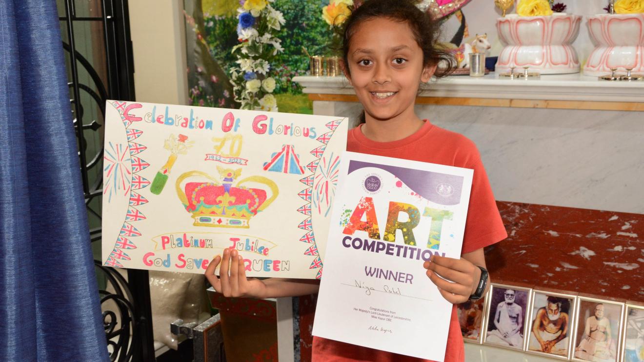 Naya Patel shows off her painting Niya Patel and her painting