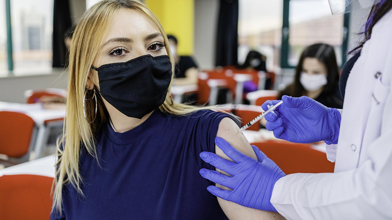 People are being urged to take steps to avoid infections A young person being vaccinated