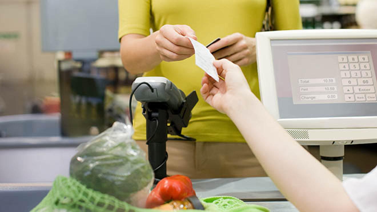 A shopper paying for food