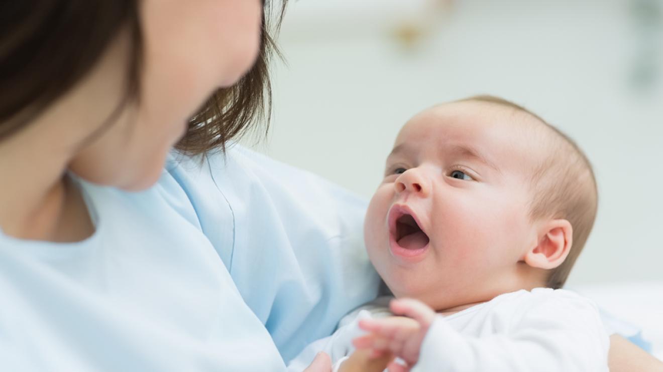 Woman holding a baby in her arms