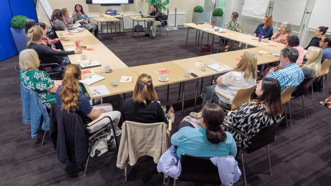 Group of people attend a board meeting