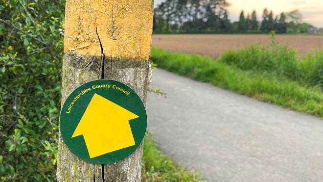 Yellow wayfinder sign