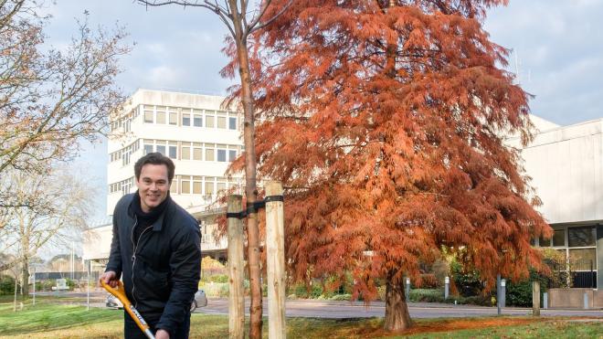 Councillor Blake Pain plants a tree