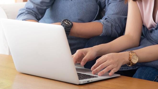 Young people using a laptop computer