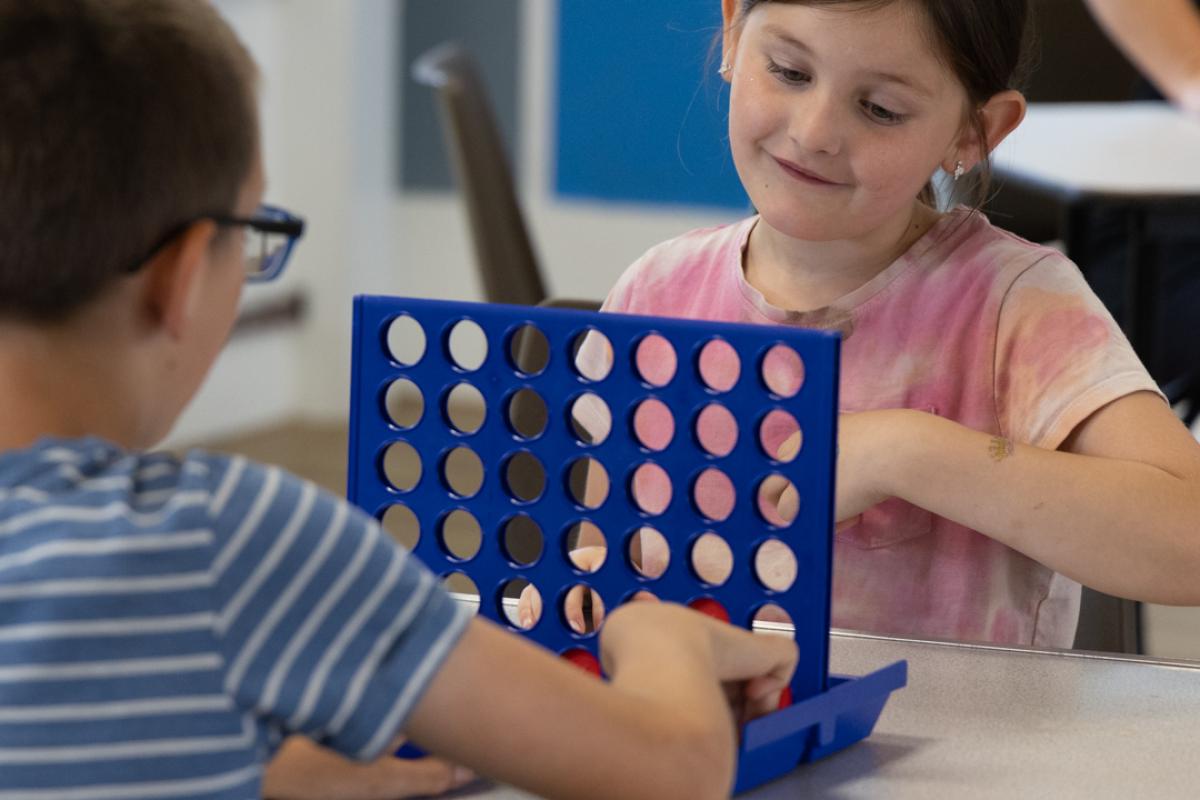 Two children playing a matching game