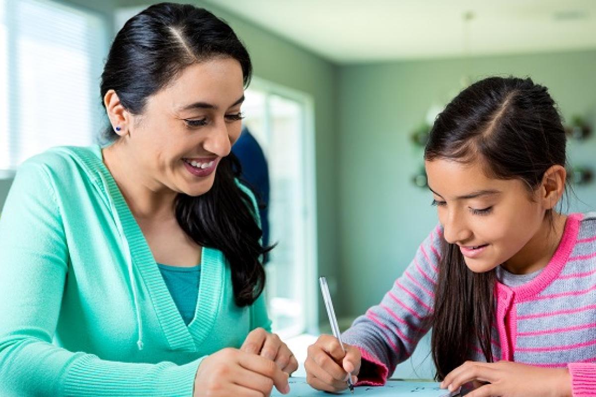 Mother with child doing homework