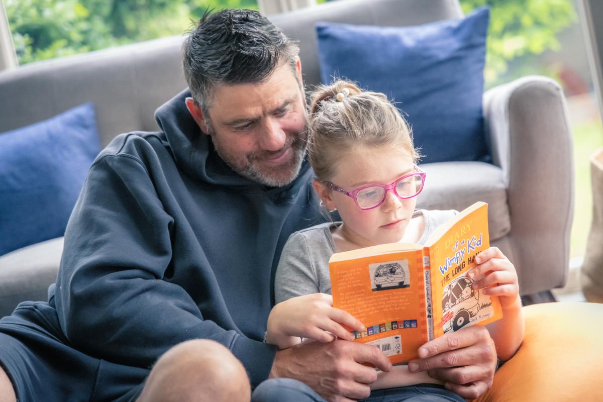 parent and child reading together