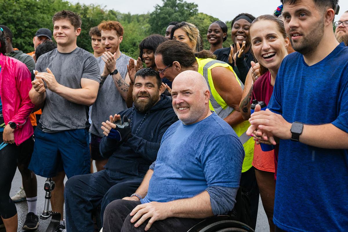 Group of people clapping and cheering in togetherness