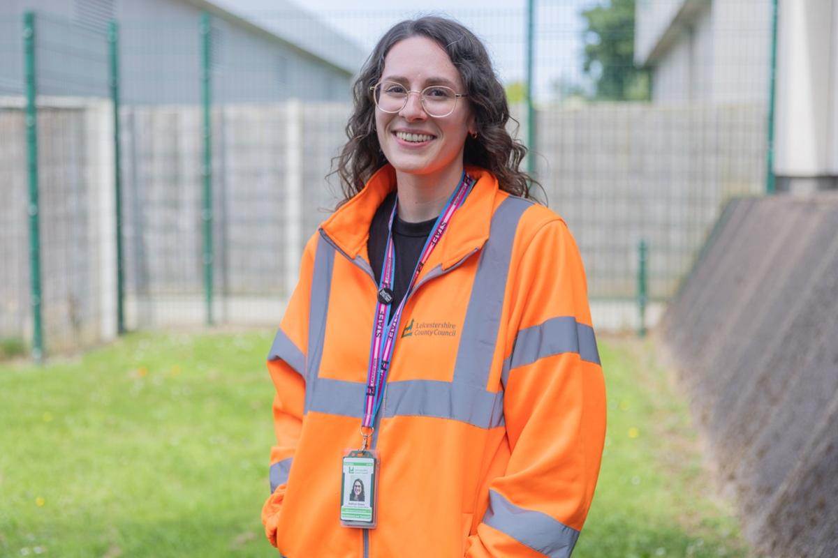 Kathryn Essex (Depot and Facilities Engineer) wearing an orange and grey Hi Vis top