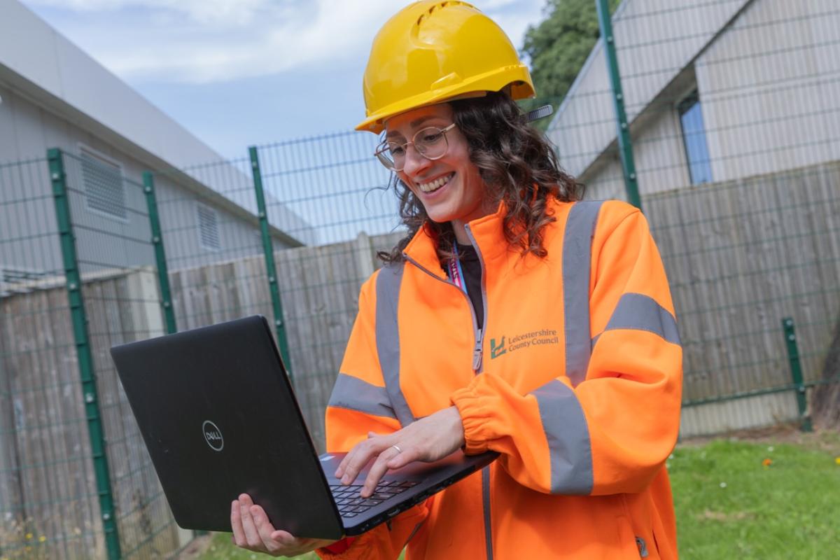 Environment and Transport staff with laptop
