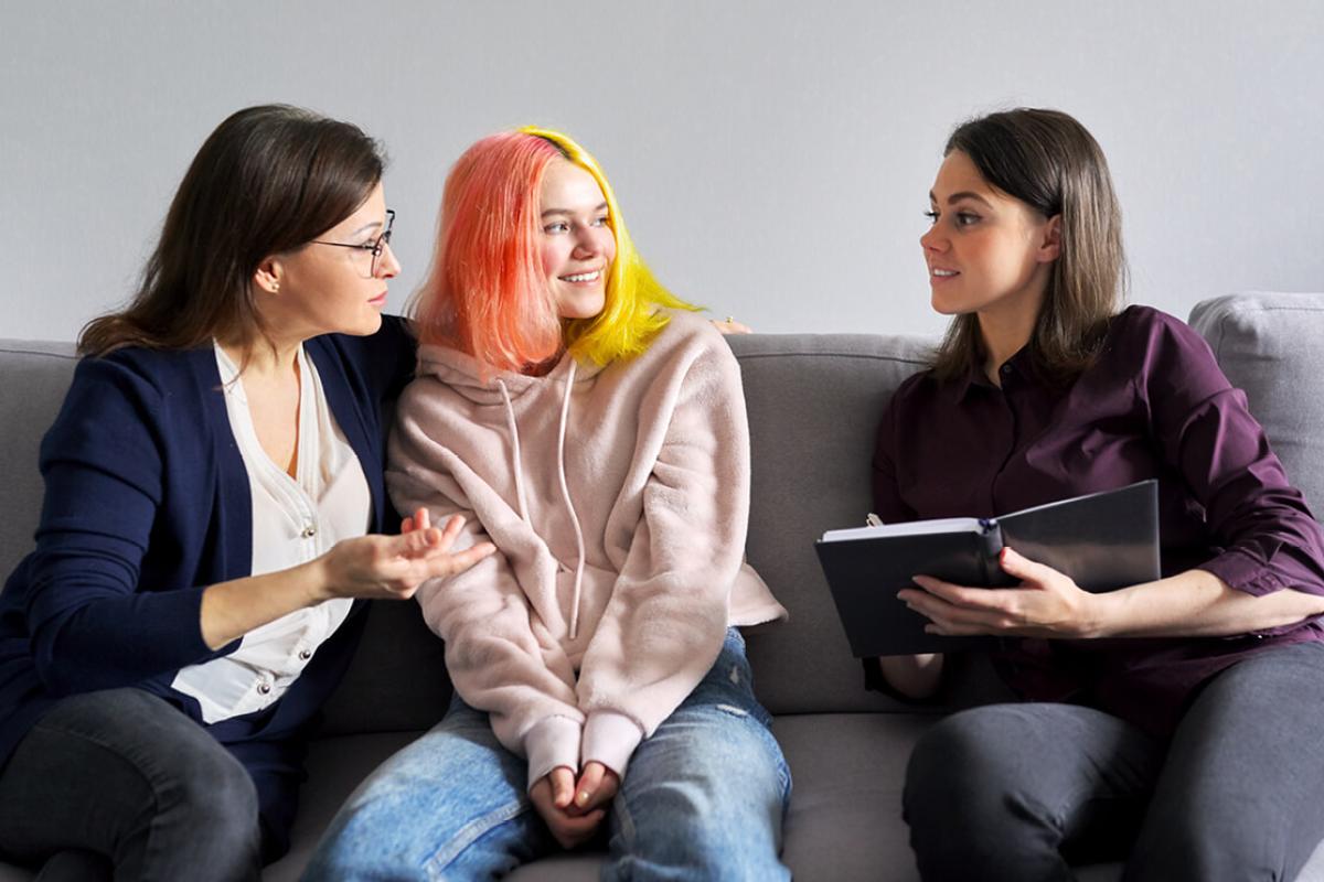 Three women having a conversation