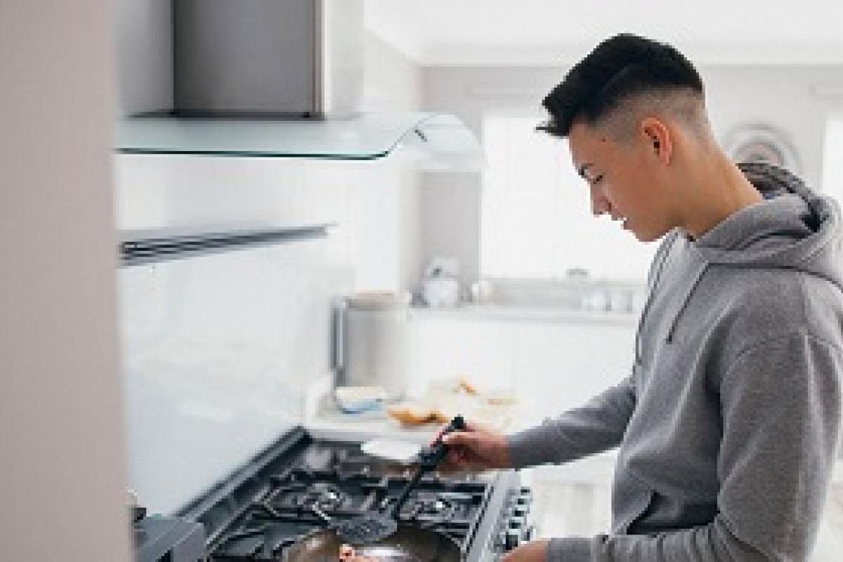 A young person in the kitchen