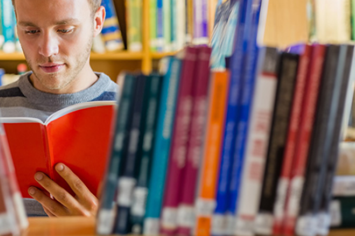 person reading in a library