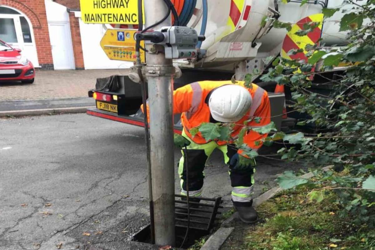 Engineer unblocking a drain