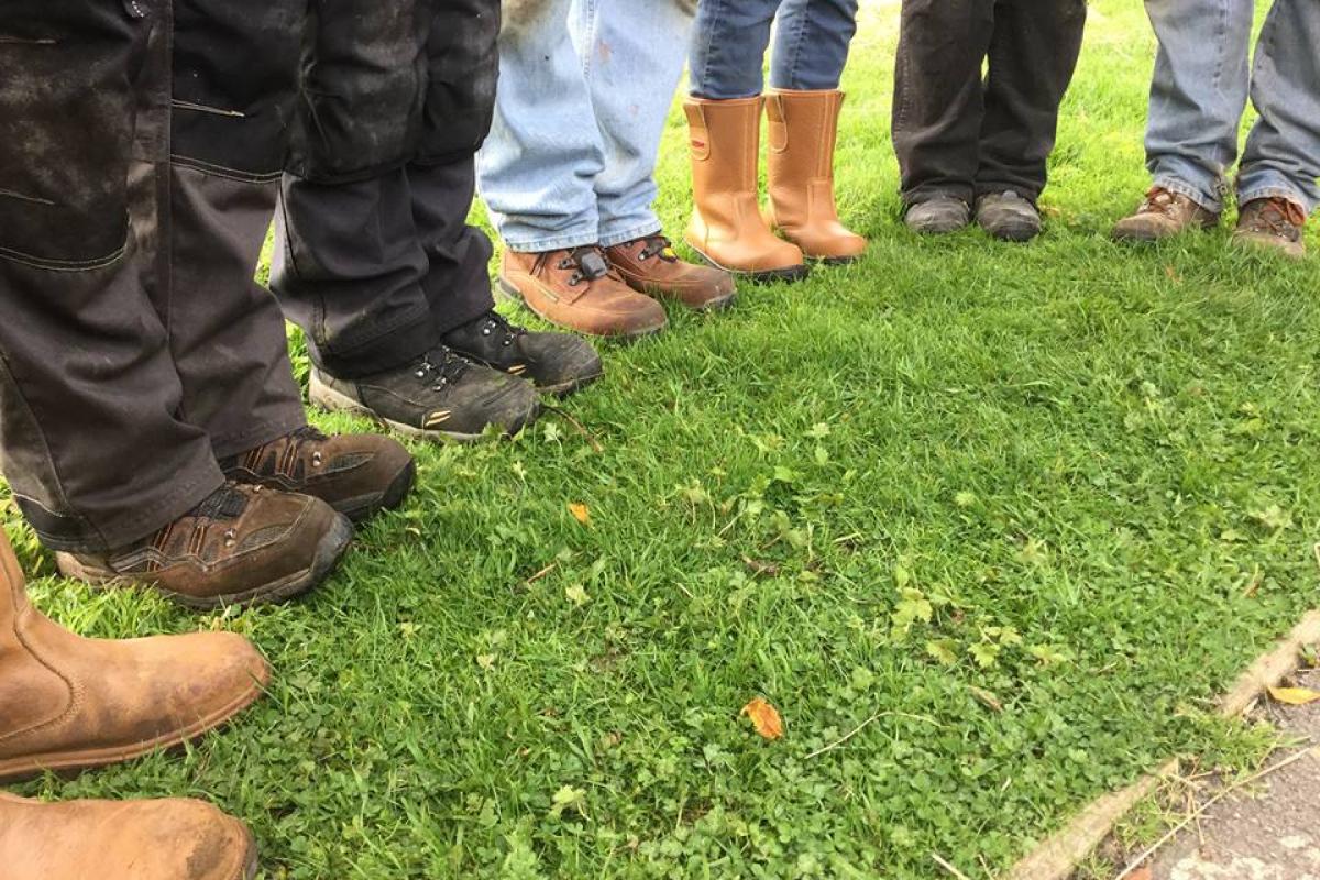 Muddy boots of conservation volunteers