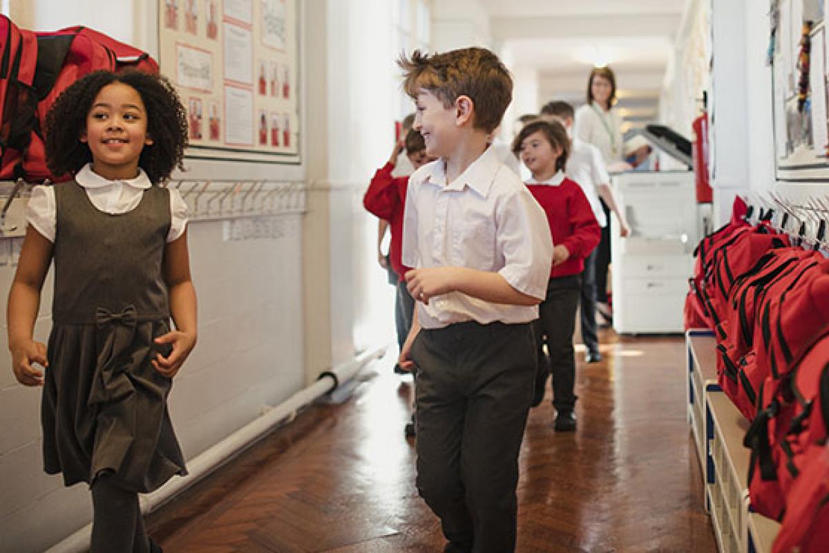 Schoolchildren in classroom corridor