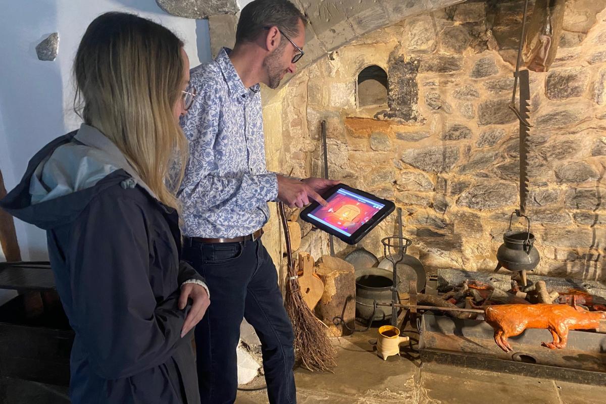 Museum visitors playing the interactive game at the 1620s House and Garden