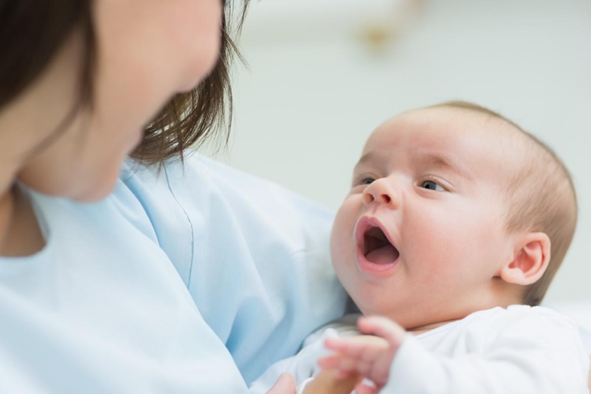 Woman holding a baby in her arms