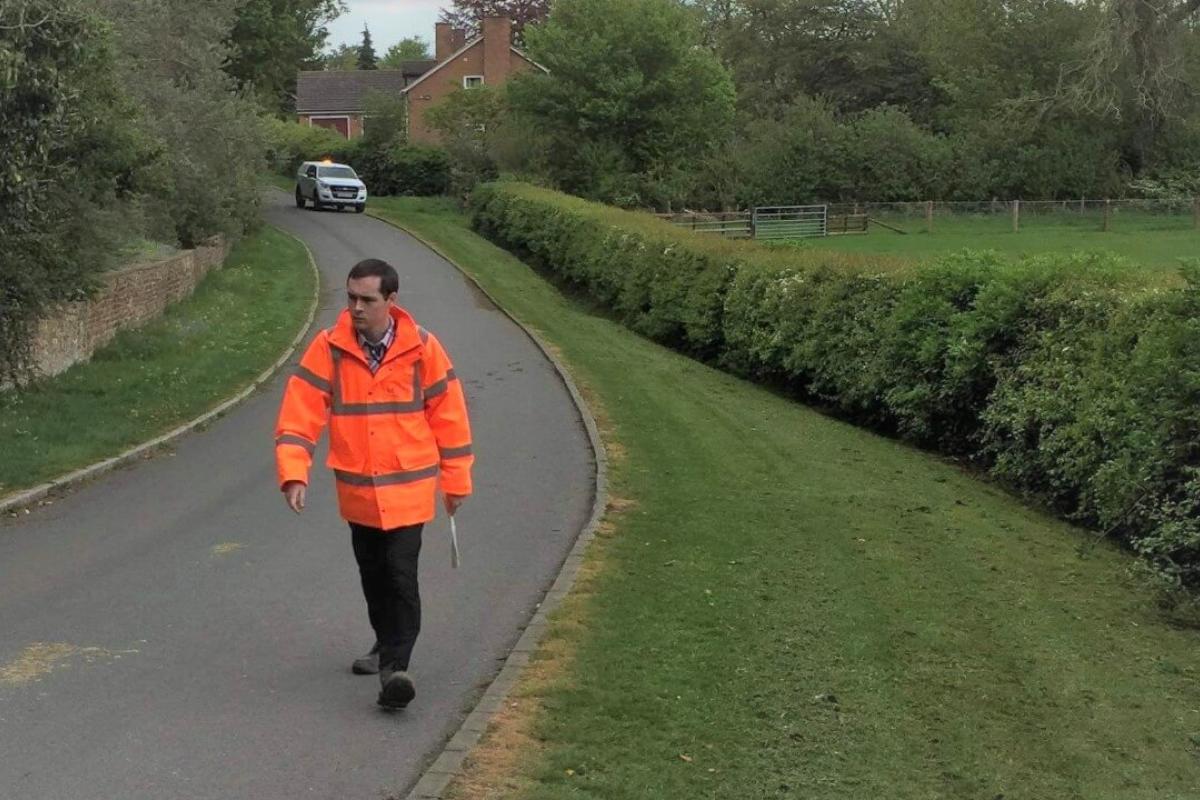 Man carrying out flood risk management assessment