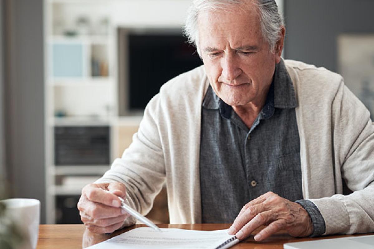 Older person reviewing papers